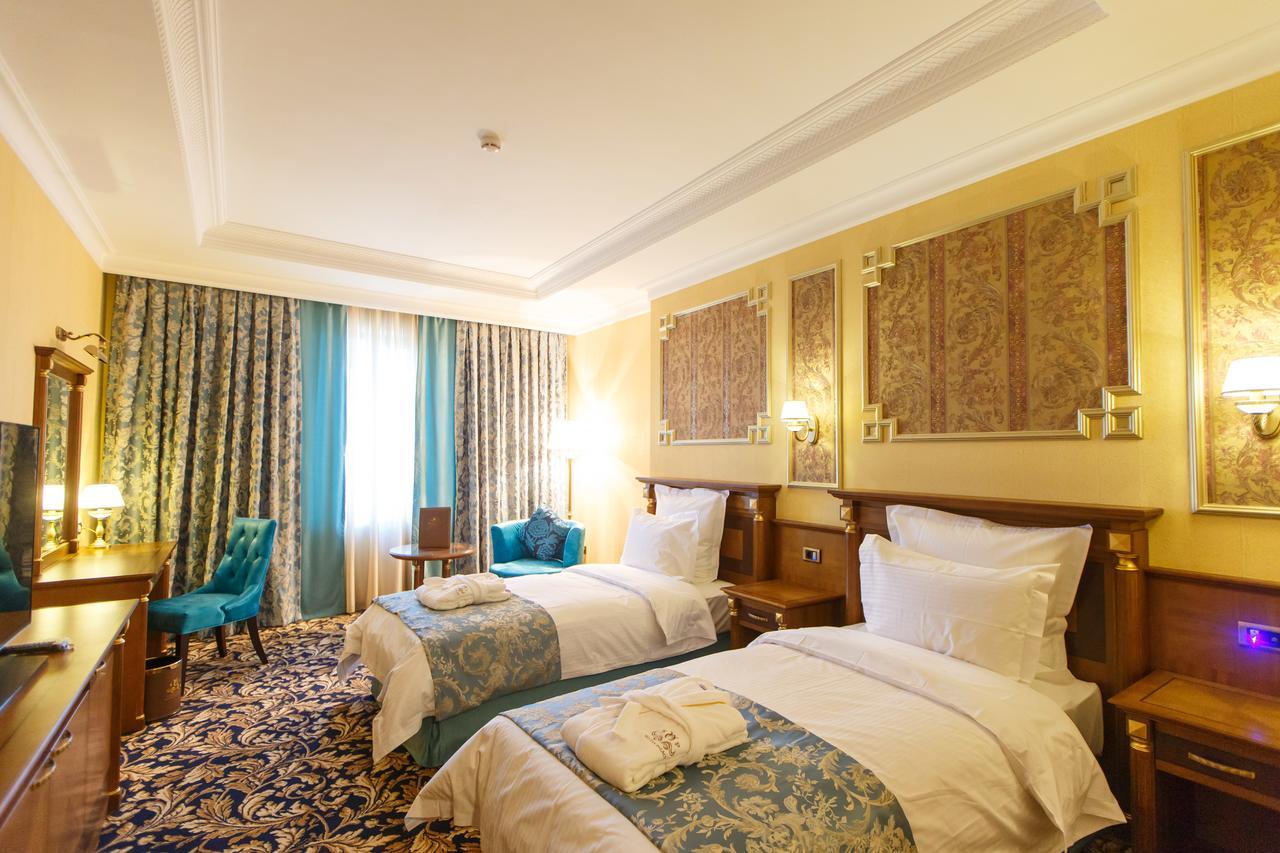 苏丹皇宫酒店 阿特劳 外观 照片 A room at the hotel